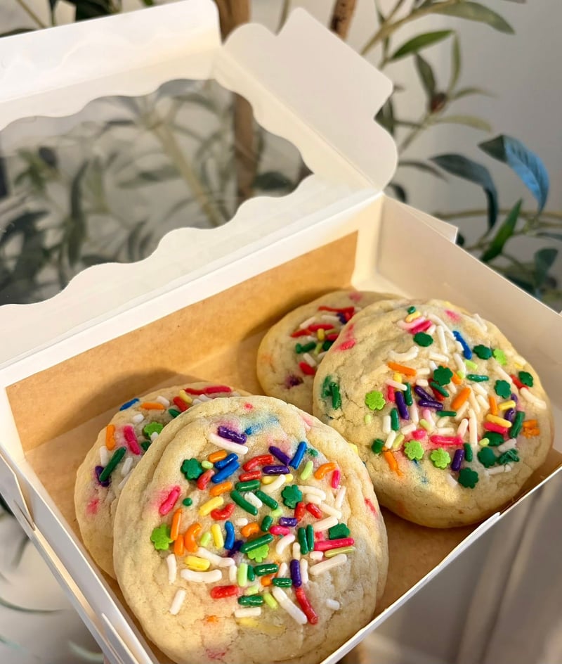 Colorful sprinkle cookies on a cooling rack